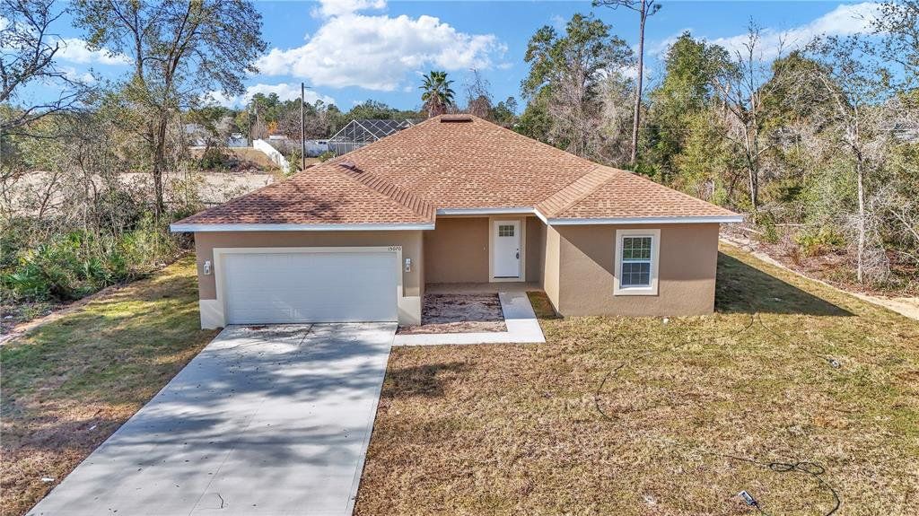 Front exterior of a new home in , Ocala, FL, highlighting curb appeal (Image 1). Front exterior of a new home in , Ocala, FL, highlighting curb appeal (Image 1).