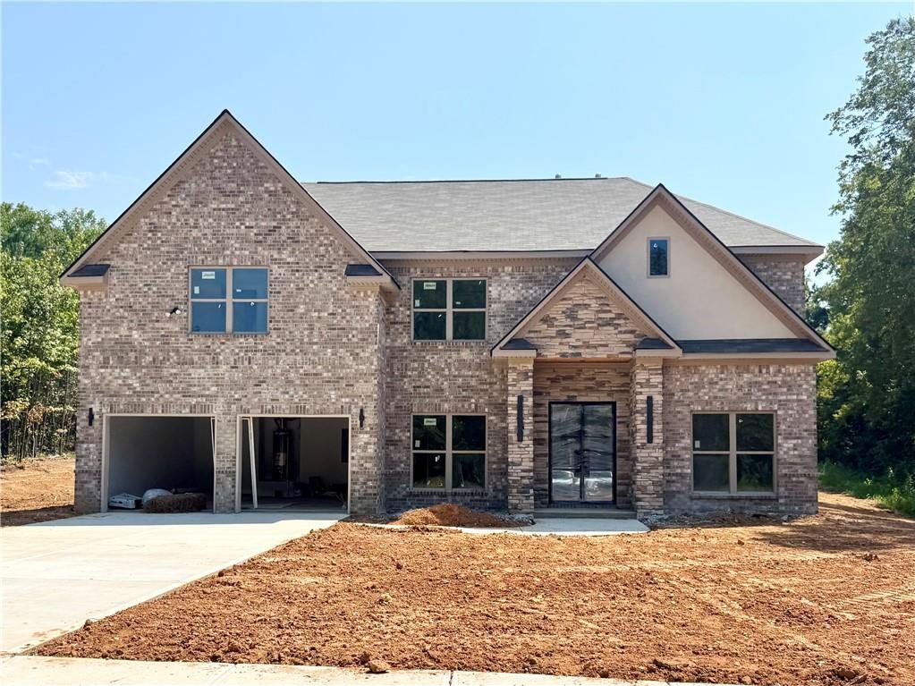 Front exterior of a new home in , Covington, GA, highlighting curb appeal (Image 1). Front exterior of a new home in , Covington, GA, highlighting curb appeal (Image 1).