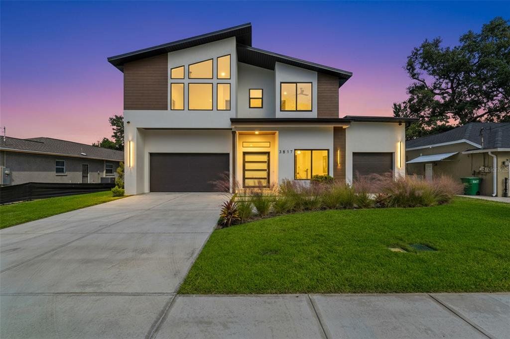 Front exterior of a new home in , Tampa, FL, highlighting curb appeal (Image 1). Front exterior of a new home in , Tampa, FL, highlighting curb appeal (Image 1).