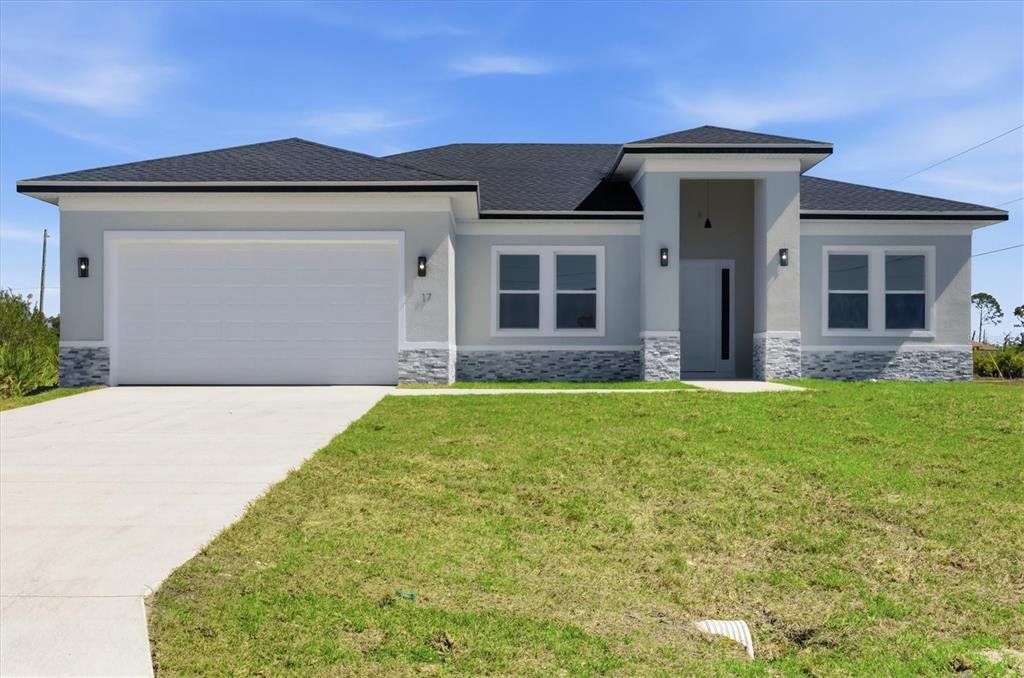 Front exterior of a new home in , Placida, FL, highlighting curb appeal (Image 1). Front exterior of a new home in , Placida, FL, highlighting curb appeal (Image 1).