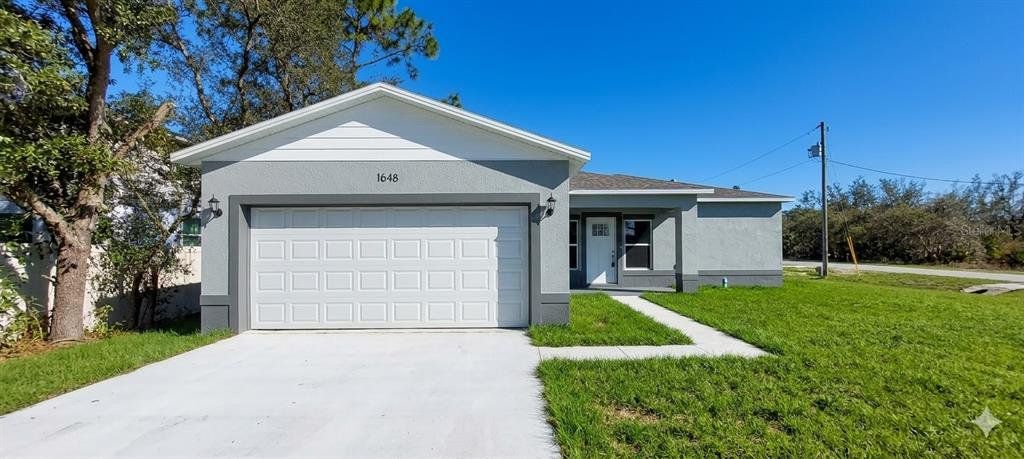 Front exterior of a new home in , Kissimmee, FL, highlighting curb appeal (Image 1). Front exterior of a new home in , Kissimmee, FL, highlighting curb appeal (Image 1).