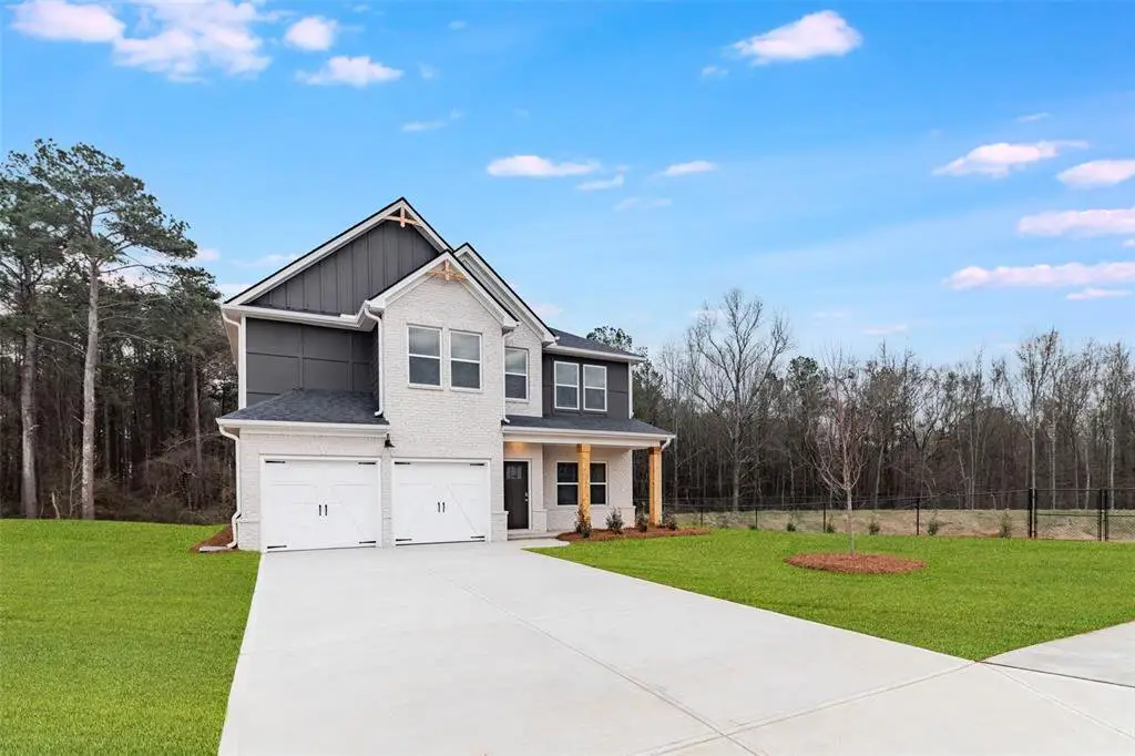 Front exterior of a new home in Conner Springs, Social Circle, GA, highlighting curb appeal (Image 1). Front exterior of a new home in Conner Springs, Social Circle, GA, highlighting curb appeal (Image 1).
