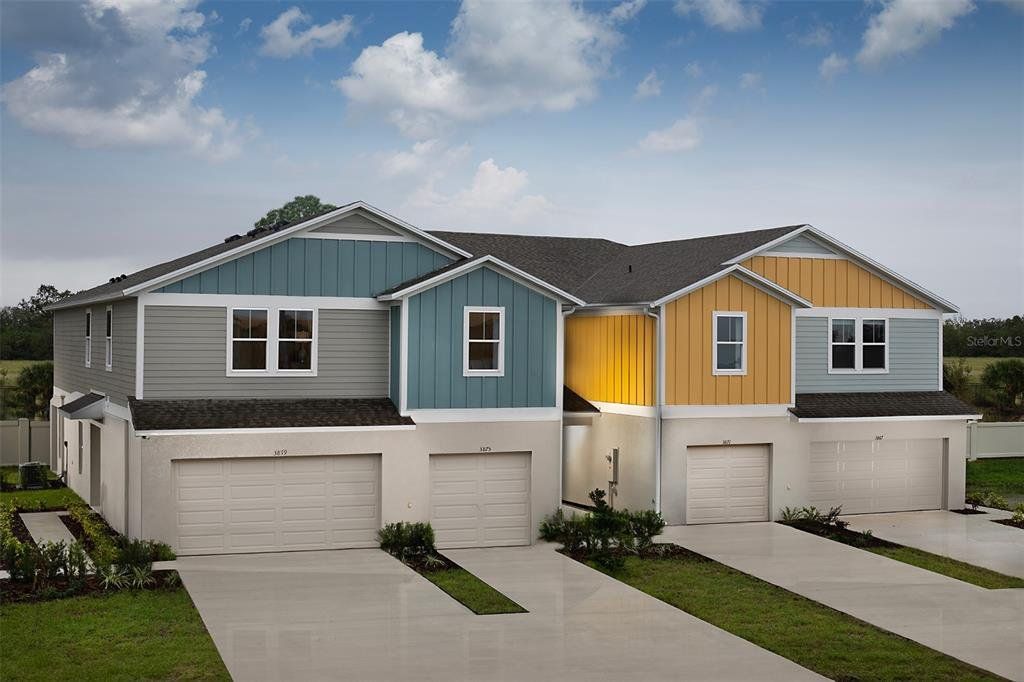 Front exterior of a new home in Grove at Crosswinds, Haines City, FL, highlighting curb appeal (Image 1). Front exterior of a new home in Grove at Crosswinds, Haines City, FL, highlighting curb appeal (Image 1).
