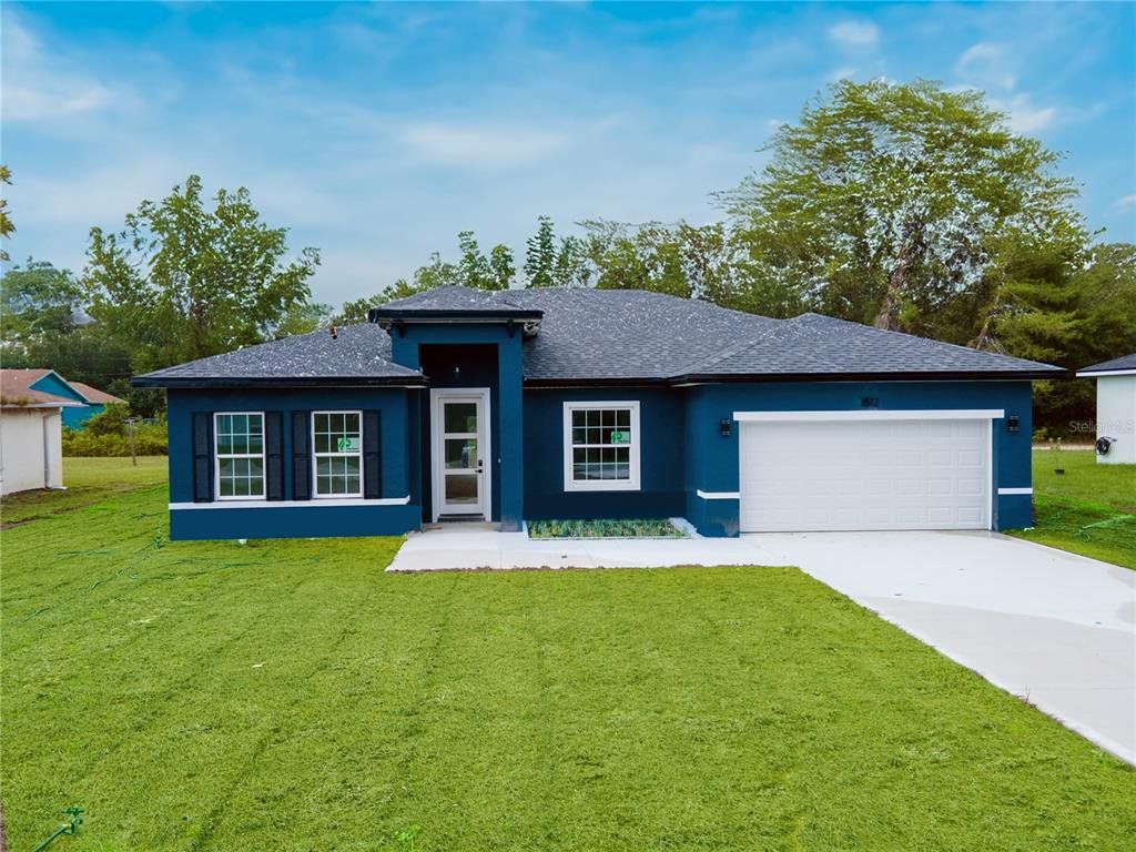 Front exterior of a new home in , Ocala, FL, highlighting curb appeal (Image 1). Front exterior of a new home in , Ocala, FL, highlighting curb appeal (Image 1).