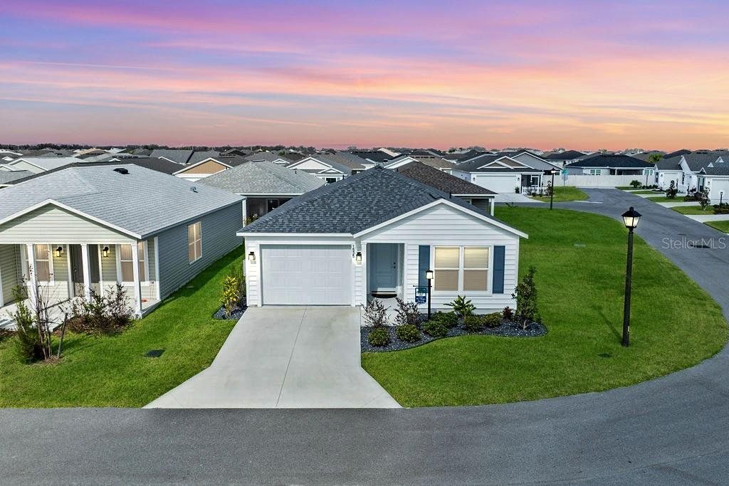 Front exterior of a new home in , The Villages, FL, highlighting curb appeal (Image 1). Front exterior of a new home in , The Villages, FL, highlighting curb appeal (Image 1).