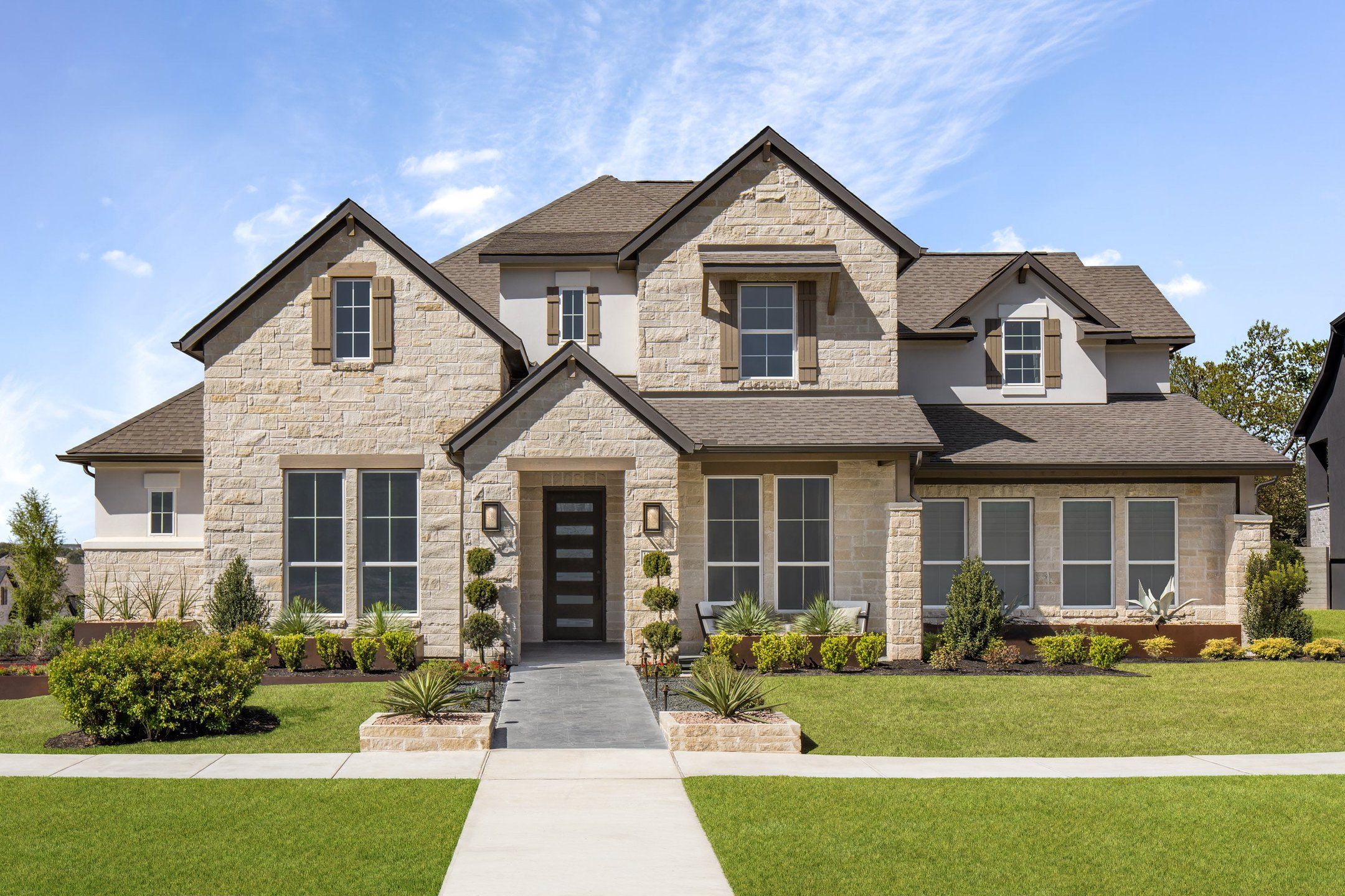 Front exterior of a new home in Wolf Ranch, Georgetown, TX, highlighting curb appeal (Image 1). Front exterior of a new home in Wolf Ranch, Georgetown, TX, highlighting curb appeal (Image 1).