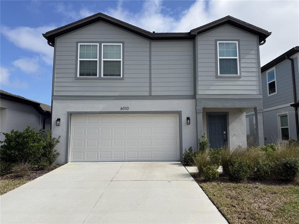 Front exterior of a new home in Waterset, Apollo Beach, FL, highlighting curb appeal (Image 1). Front exterior of a new home in Waterset, Apollo Beach, FL, highlighting curb appeal (Image 1).