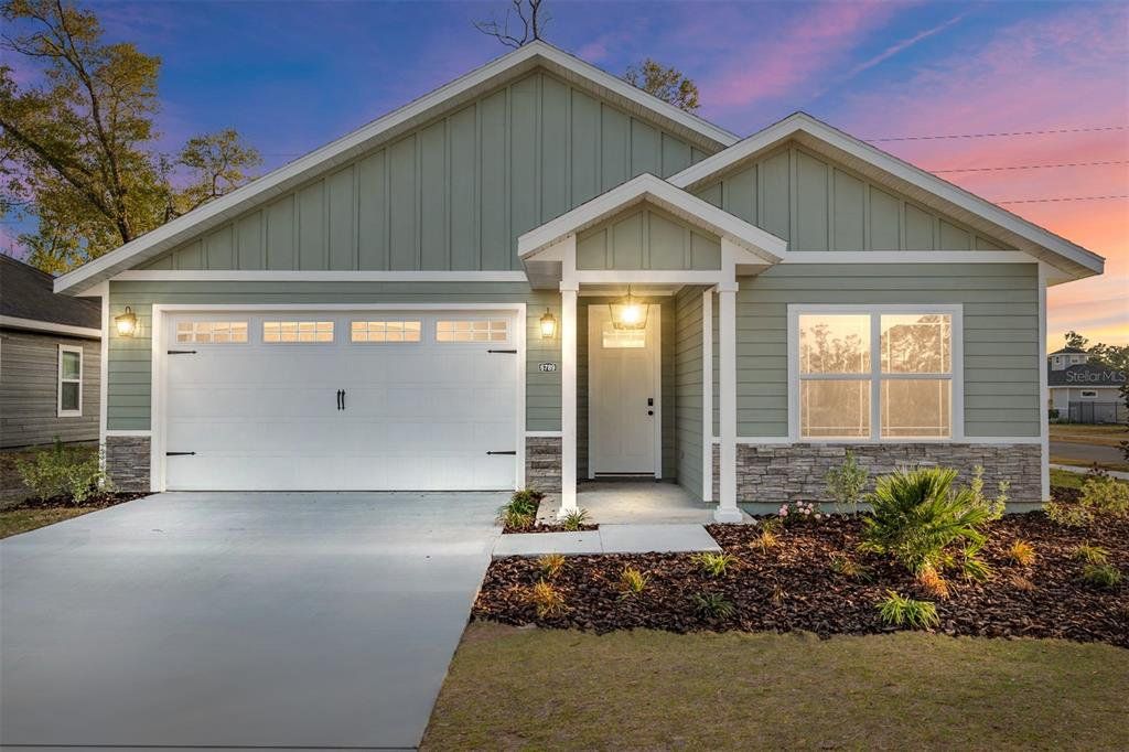 Front exterior of a new home in Grand Oaks, Gainesville, FL, highlighting curb appeal (Image 1). Front exterior of a new home in Grand Oaks, Gainesville, FL, highlighting curb appeal (Image 1).