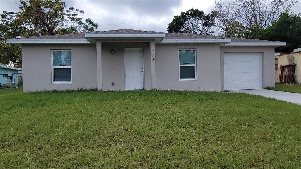 Front exterior of a new home in , Daytona Beach, FL, highlighting curb appeal (Image 1). Front exterior of a new home in , Daytona Beach, FL, highlighting curb appeal (Image 1).