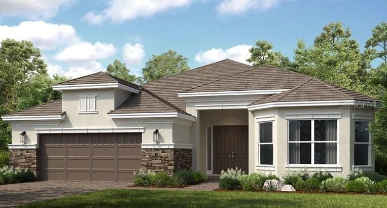Front exterior of a new home in Esplanade at Wiregrass Ranch, Wesley Chapel, FL, highlighting curb appeal (Image 1). Front exterior of a new home in Esplanade at Wiregrass Ranch, Wesley Chapel, FL, highlighting curb appeal (Image 1).