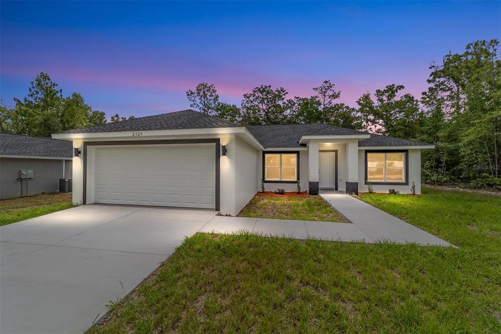 Front exterior of a new home in , Ocala, FL, highlighting curb appeal (Image 1). Front exterior of a new home in , Ocala, FL, highlighting curb appeal (Image 1).