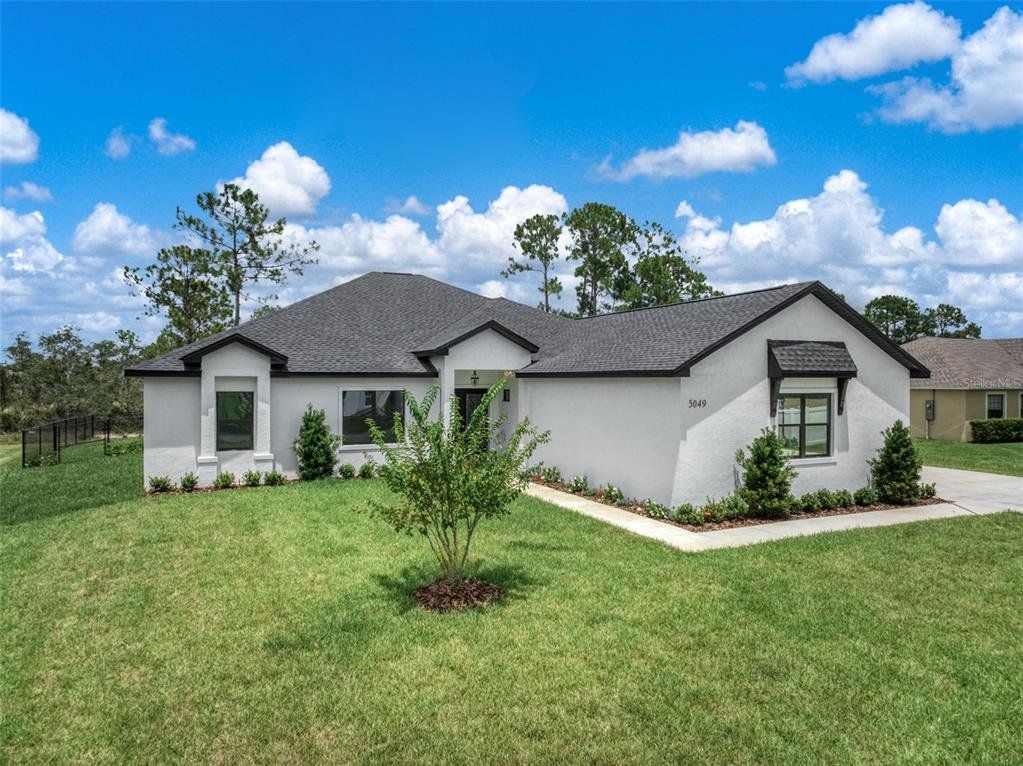 Front exterior of a new home in , Sebring, FL, highlighting curb appeal (Image 1). Front exterior of a new home in , Sebring, FL, highlighting curb appeal (Image 1).