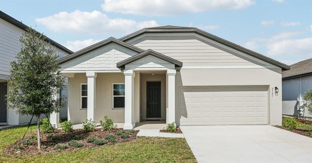 Front exterior of a new home in Sunbrooke, St. Cloud, FL, highlighting curb appeal (Image 1). Front exterior of a new home in Sunbrooke, St. Cloud, FL, highlighting curb appeal (Image 1).