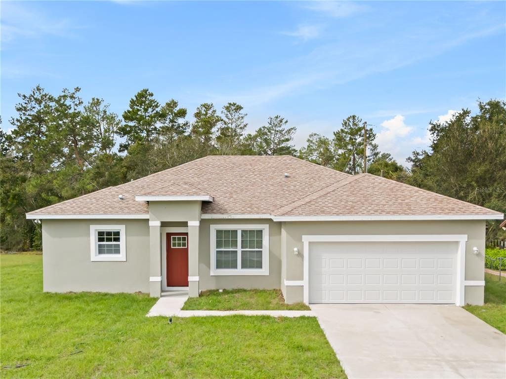 Front exterior of a new home in , Ocala, FL, highlighting curb appeal (Image 1). Front exterior of a new home in , Ocala, FL, highlighting curb appeal (Image 1).
