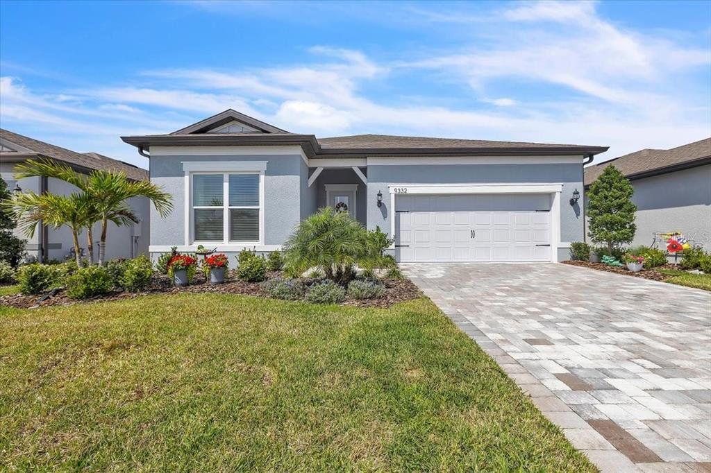 Front exterior of a new home in , Parrish, FL, highlighting curb appeal (Image 1). Front exterior of a new home in , Parrish, FL, highlighting curb appeal (Image 1).