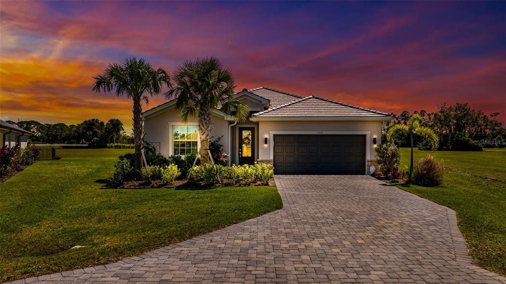 Front exterior of a new home in , Punta Gorda, FL, highlighting curb appeal (Image 1). Front exterior of a new home in , Punta Gorda, FL, highlighting curb appeal (Image 1).