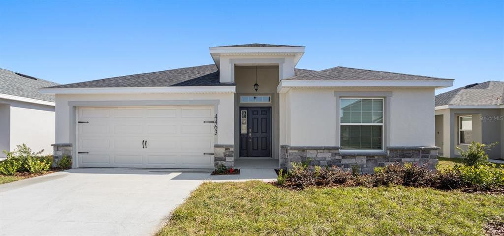 Front exterior of a new home in VillaMar, Winter Haven, FL, highlighting curb appeal (Image 1). Front exterior of a new home in VillaMar, Winter Haven, FL, highlighting curb appeal (Image 1).