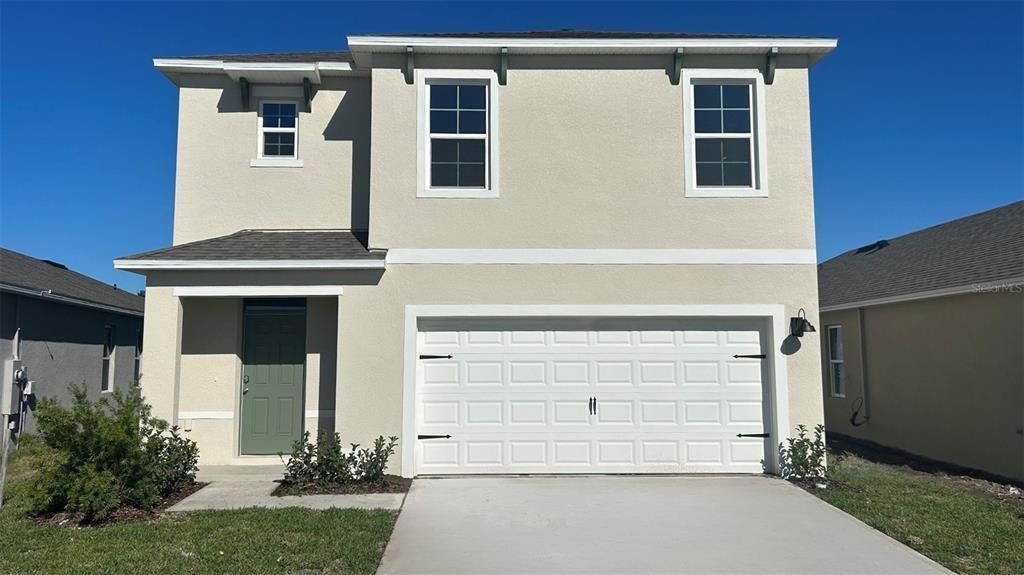 Front exterior of a new home in Campbell Crossing, Port Orange, FL, highlighting curb appeal (Image 1). Front exterior of a new home in Campbell Crossing, Port Orange, FL, highlighting curb appeal (Image 1).