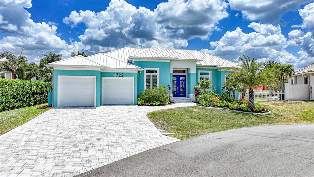 Front exterior of a new home in , Punta Gorda, FL, highlighting curb appeal (Image 1). Front exterior of a new home in , Punta Gorda, FL, highlighting curb appeal (Image 1).