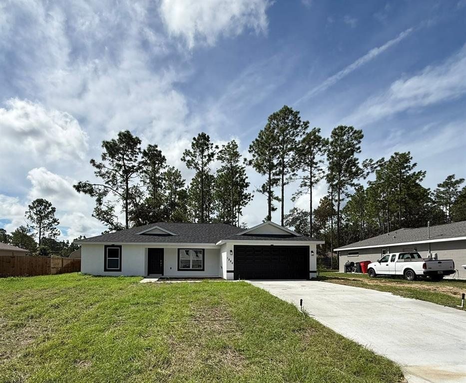 Front exterior of a new home in , Citrus Springs, FL, highlighting curb appeal (Image 1). Front exterior of a new home in , Citrus Springs, FL, highlighting curb appeal (Image 1).