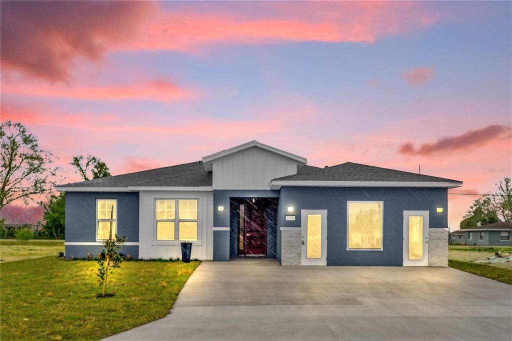 Front exterior of a new home in , Winter Haven, FL, highlighting curb appeal (Image 1). Front exterior of a new home in , Winter Haven, FL, highlighting curb appeal (Image 1).