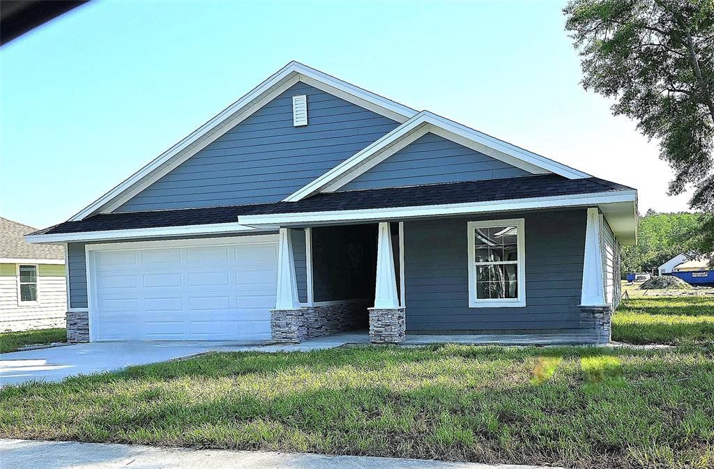 Front exterior of a new home in The Preserve at Laurel Lake, Lake City, FL, highlighting curb appeal (Image 1). Front exterior of a new home in The Preserve at Laurel Lake, Lake City, FL, highlighting curb appeal (Image 1).