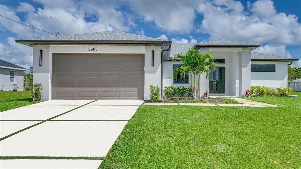 Front exterior of a new home in , Lehigh Acres, FL, highlighting curb appeal (Image 1). Front exterior of a new home in , Lehigh Acres, FL, highlighting curb appeal (Image 1).