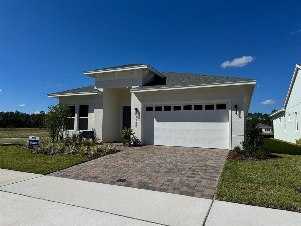 Front exterior of a new home in Ridgehaven, Ormond Beach, FL, highlighting curb appeal (Image 1). Front exterior of a new home in Ridgehaven, Ormond Beach, FL, highlighting curb appeal (Image 1).