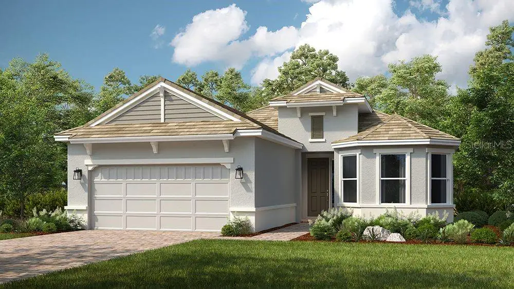 Front exterior of a new home in Esplanade at Skye Ranch, Sarasota, FL, highlighting curb appeal (Image 1). Front exterior of a new home in Esplanade at Skye Ranch, Sarasota, FL, highlighting curb appeal (Image 1).