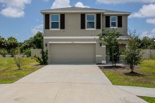 Front exterior of a new home in Evergreen, Bradenton, FL, highlighting curb appeal (Image 1). Front exterior of a new home in Evergreen, Bradenton, FL, highlighting curb appeal (Image 1).