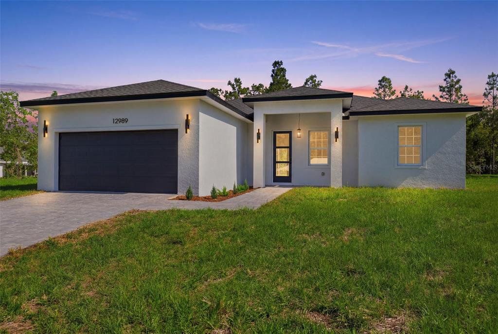 Front exterior of a new home in , Ocala, FL, highlighting curb appeal (Image 1). Front exterior of a new home in , Ocala, FL, highlighting curb appeal (Image 1).