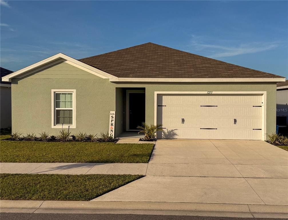 Front exterior of a new home in , Haines City, FL, highlighting curb appeal (Image 1). Front exterior of a new home in , Haines City, FL, highlighting curb appeal (Image 1).