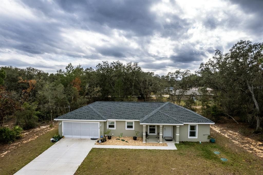 Front exterior of a new home in , Ocklawaha, FL, highlighting curb appeal (Image 1). Front exterior of a new home in , Ocklawaha, FL, highlighting curb appeal (Image 1).