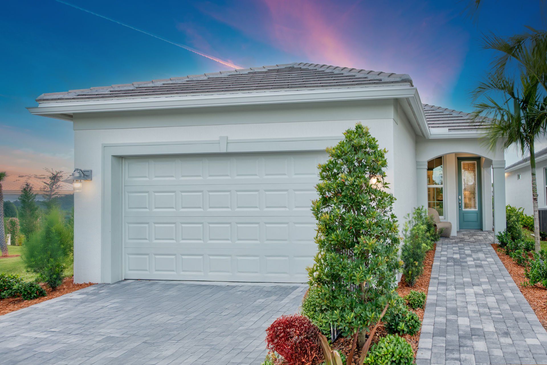 Front exterior of a new home in Costa Pointe, Vero Beach, FL, highlighting curb appeal (Image 1). Front exterior of a new home in Costa Pointe, Vero Beach, FL, highlighting curb appeal (Image 1).