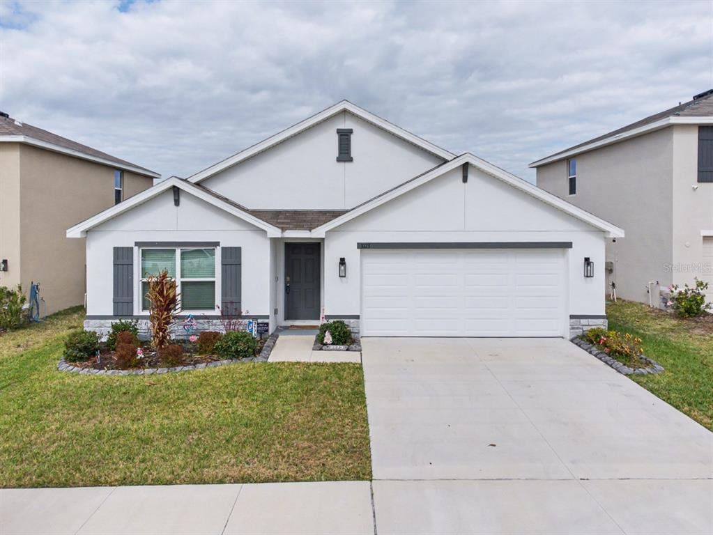 Front exterior of a new home in , Wimauma, FL, highlighting curb appeal (Image 1). Front exterior of a new home in , Wimauma, FL, highlighting curb appeal (Image 1).