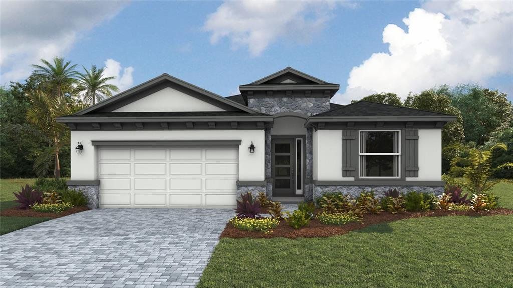 Front exterior of a new home in Legacy Preserve, Parrish, FL, highlighting curb appeal (Image 1). Front exterior of a new home in Legacy Preserve, Parrish, FL, highlighting curb appeal (Image 1).