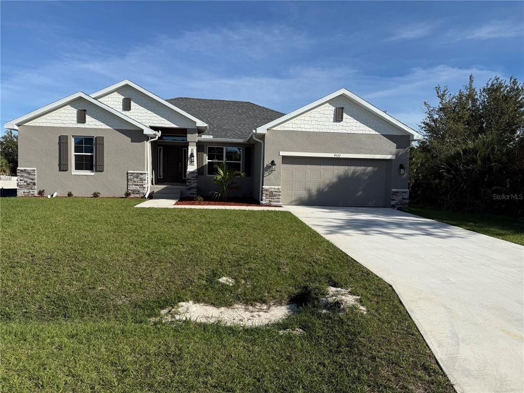Front exterior of a new home in , Port Charlotte, FL, highlighting curb appeal (Image 1). Front exterior of a new home in , Port Charlotte, FL, highlighting curb appeal (Image 1).