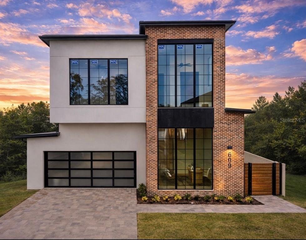Front exterior of a new home in , Winter Park, FL, highlighting curb appeal (Image 1). Front exterior of a new home in , Winter Park, FL, highlighting curb appeal (Image 1).
