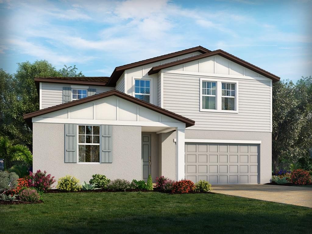 Front exterior of a new home in Villamar - Signature Series, Winter Haven, FL, highlighting curb appeal (Image 1). Front exterior of a new home in Villamar - Signature Series, Winter Haven, FL, highlighting curb appeal (Image 1).