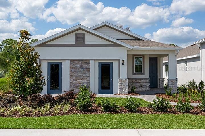 Front exterior of a new home in Liberty Station, Orange City, FL, highlighting curb appeal (Image 1). Front exterior of a new home in Liberty Station, Orange City, FL, highlighting curb appeal (Image 1).