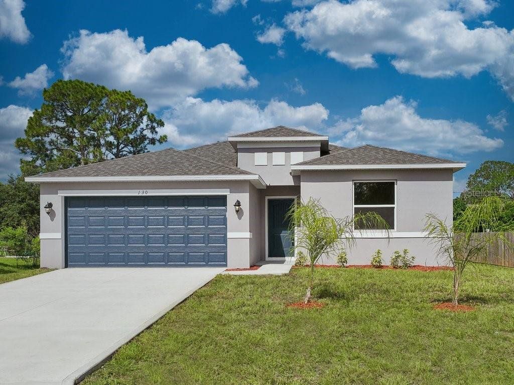 Front exterior of a new home in , Palm Coast, FL, highlighting curb appeal (Image 1). Front exterior of a new home in , Palm Coast, FL, highlighting curb appeal (Image 1).