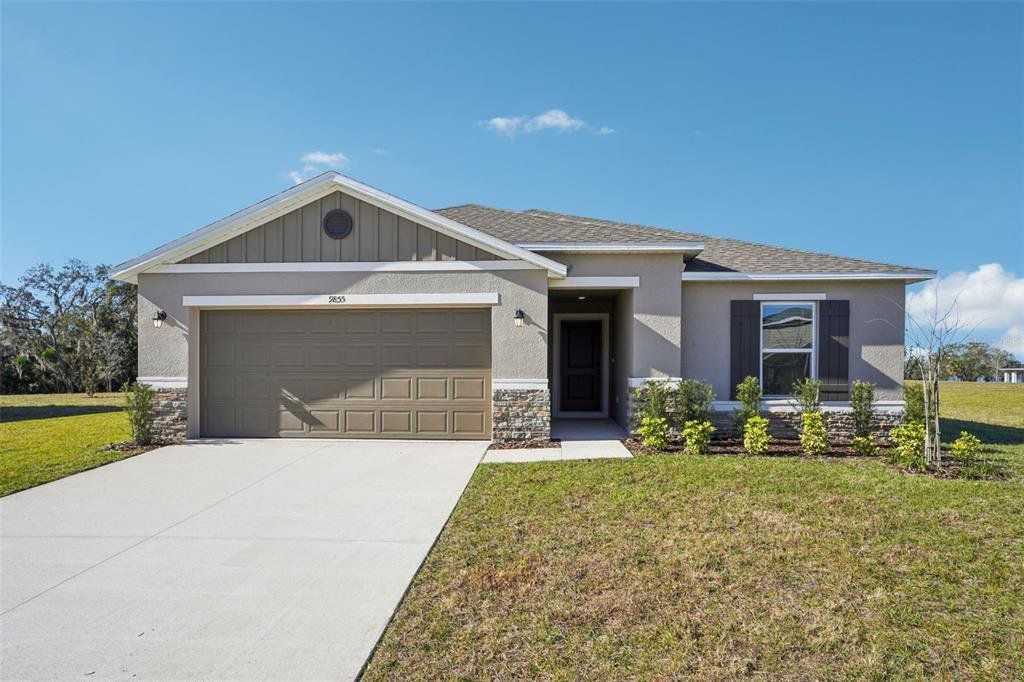 Front exterior of a new home in Silver Lake Estates II, Leesburg, FL, highlighting curb appeal (Image 1). Front exterior of a new home in Silver Lake Estates II, Leesburg, FL, highlighting curb appeal (Image 1).