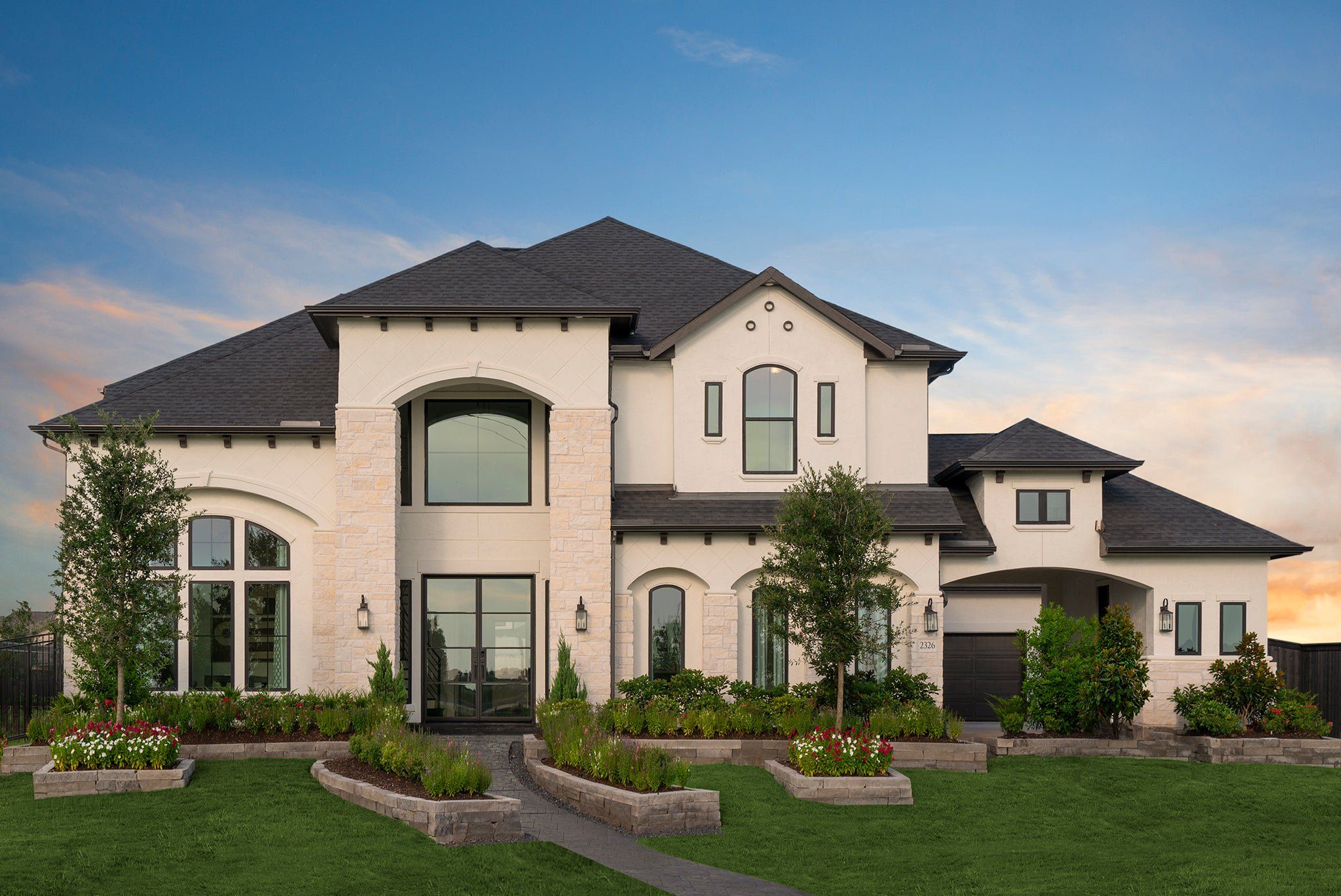 Front exterior of a new home in Harvest Green, Richmond, TX, highlighting curb appeal (Image 1). Front exterior of a new home in Harvest Green, Richmond, TX, highlighting curb appeal (Image 1).