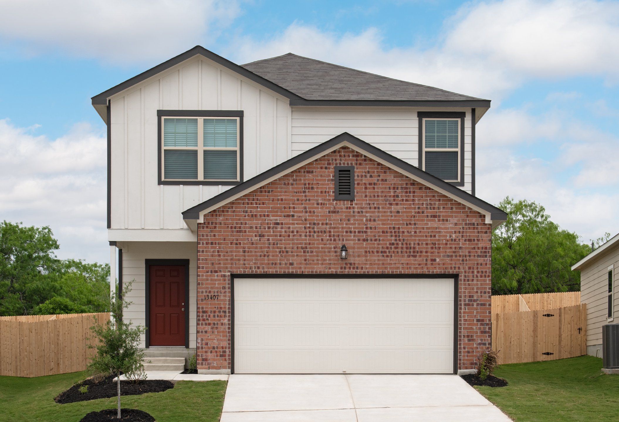 Front exterior of a new home in Williams Landing, Waller, TX, highlighting curb appeal (Image 1).