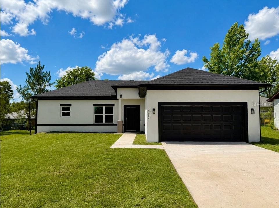 Front exterior of a new home in , Ocala, FL, highlighting curb appeal (Image 1). Front exterior of a new home in , Ocala, FL, highlighting curb appeal (Image 1).