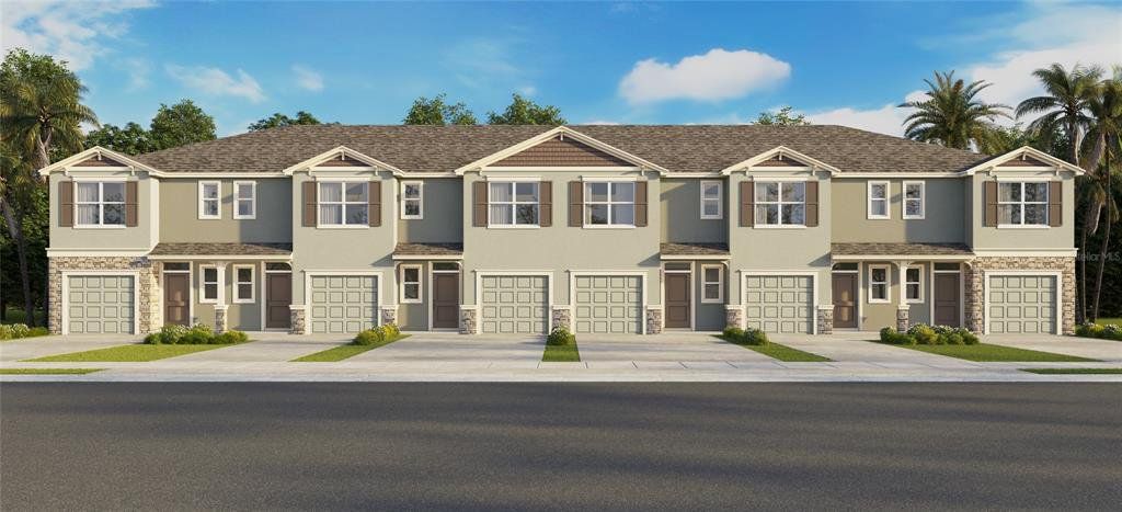 Front exterior of a new home in Woodcreek, Wesley Chapel, FL, highlighting curb appeal (Image 1). Front exterior of a new home in Woodcreek, Wesley Chapel, FL, highlighting curb appeal (Image 1).