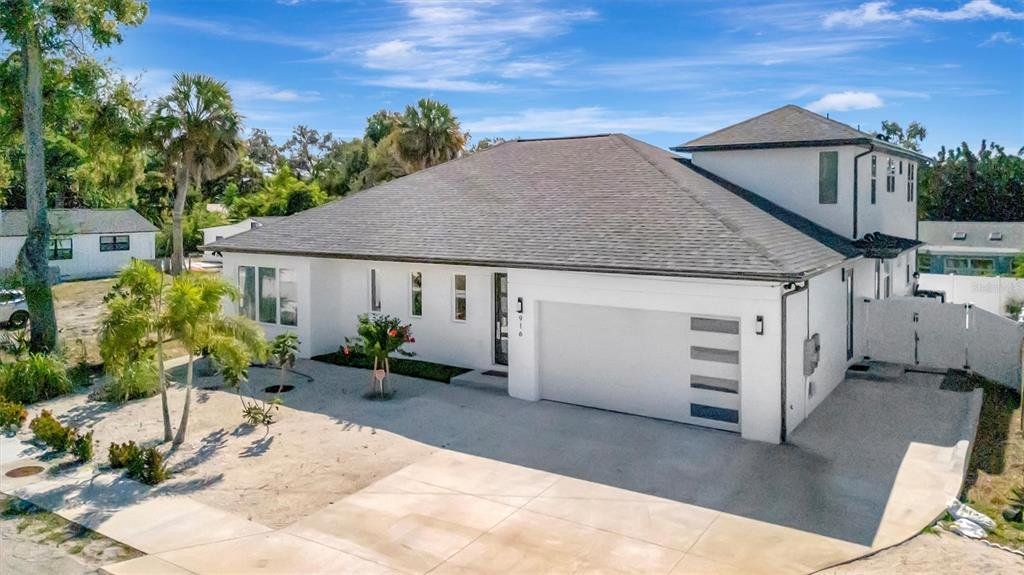 Front exterior of a new home in , Sarasota, FL, highlighting curb appeal (Image 1). Front exterior of a new home in , Sarasota, FL, highlighting curb appeal (Image 1).
