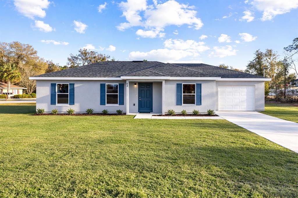 Front exterior of a new home in , Ocala, FL, highlighting curb appeal (Image 1). Front exterior of a new home in , Ocala, FL, highlighting curb appeal (Image 1).