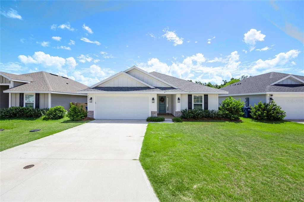 Front exterior of a new home in , Newberry, FL, highlighting curb appeal (Image 1). Front exterior of a new home in , Newberry, FL, highlighting curb appeal (Image 1).