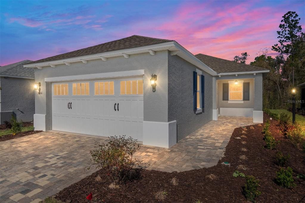Front exterior of a new home in On Top of the World Communities, Ocala, FL, highlighting curb appeal (Image 1). Front exterior of a new home in On Top of the World Communities, Ocala, FL, highlighting curb appeal (Image 1).